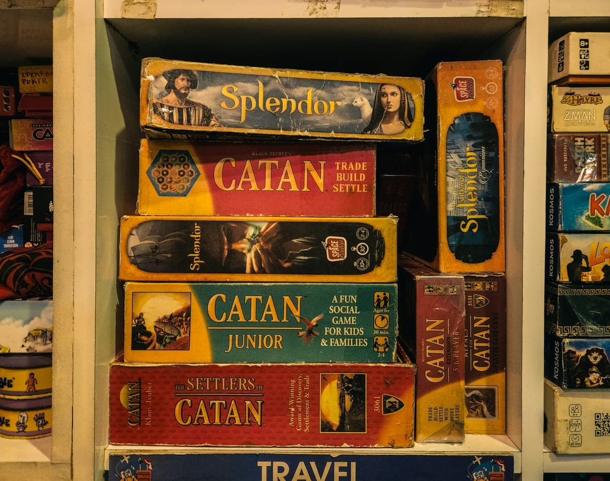 Board game shelf with Catan, Splendor, and more